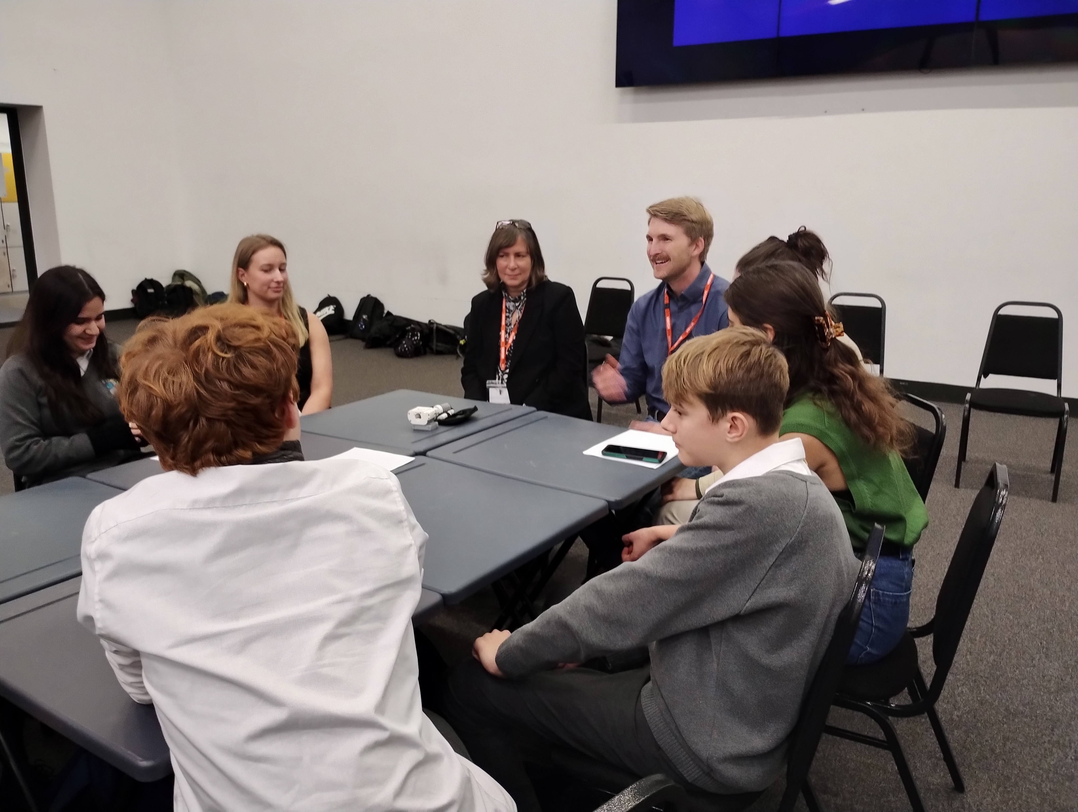 Volunteers talking to the students during the carousel session