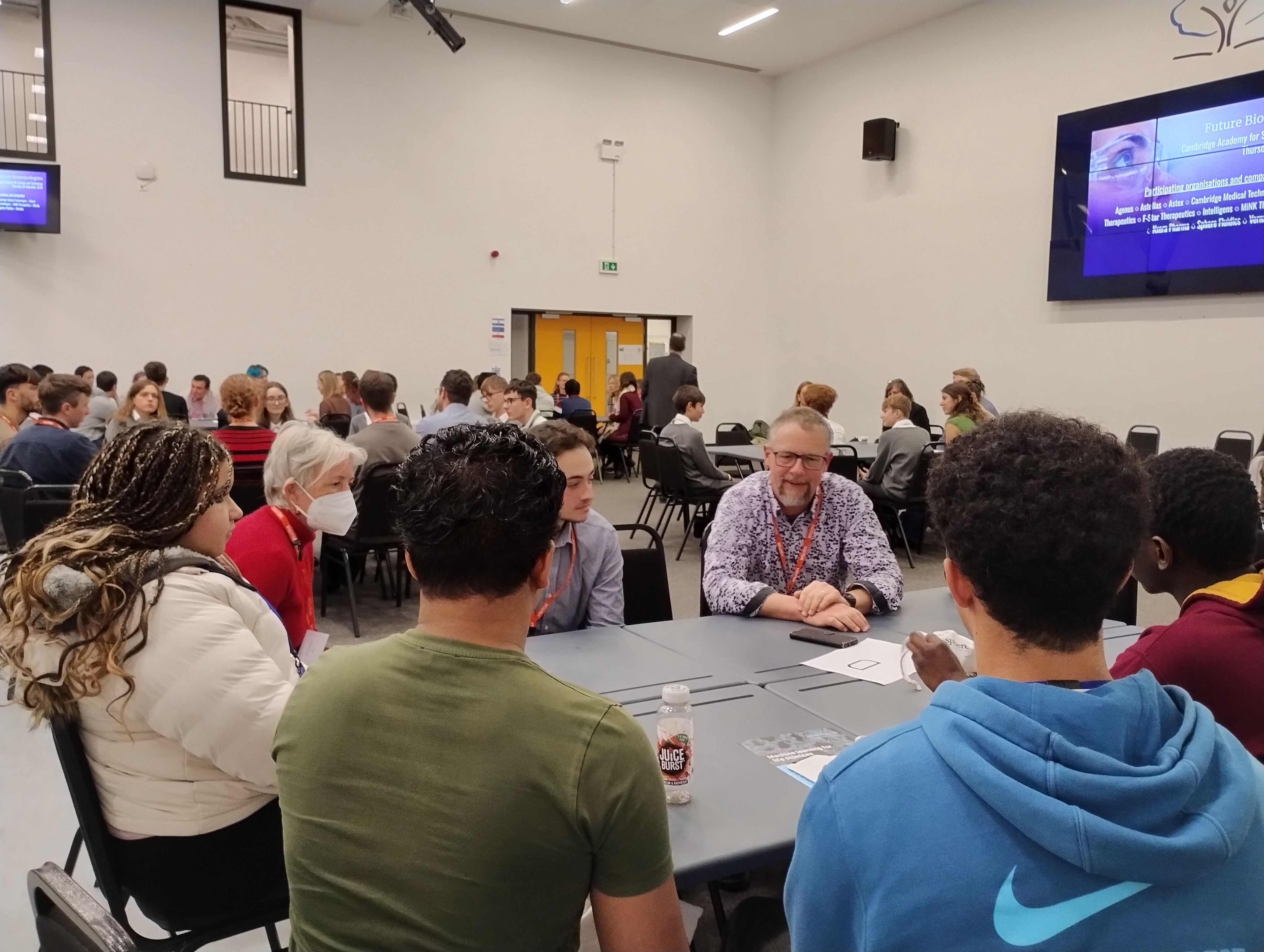 Volunteers talking to the students during the carousel session