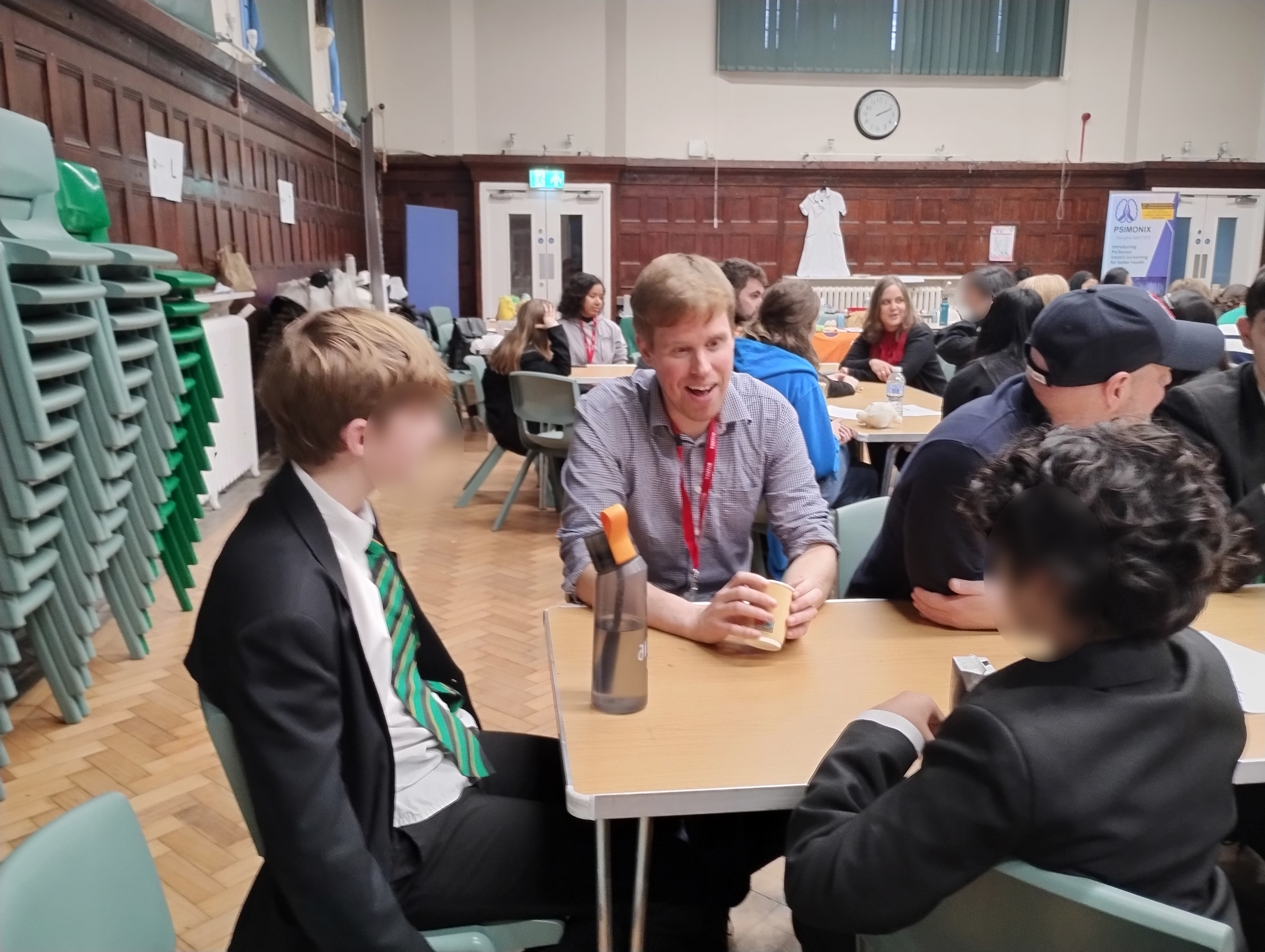 Daniel Miller chats to two students